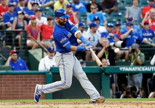 In this Thursday, Oct. 6, 2016, file photo, Toronto Blue Jays' Jose Bautista connects for a three-run home run off Texas Rangers' Jake Diekman during the ninth inning in Game 1 of baseball's American League Division Series, in Arlington, Texas.