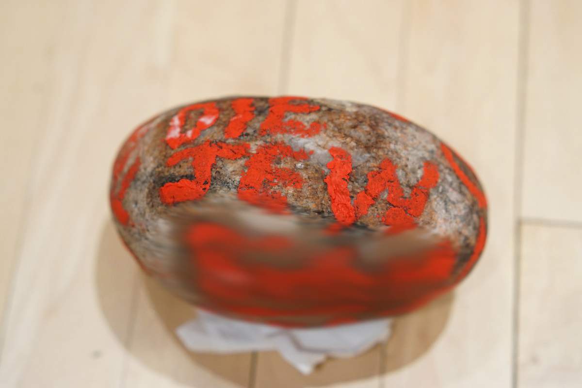 Photo of a rock with racist writing on it was left on a doorstep of a home in Wolseley.
