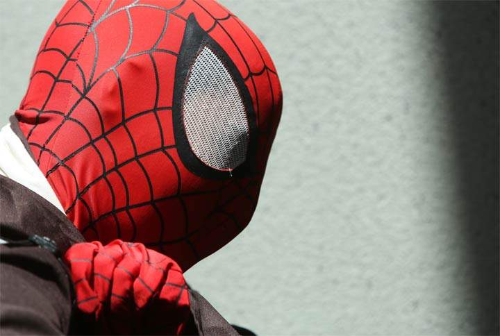 The Saskatoon Police Service is investigating after a business was robbed by an armed man wearing a Spiderman mask.