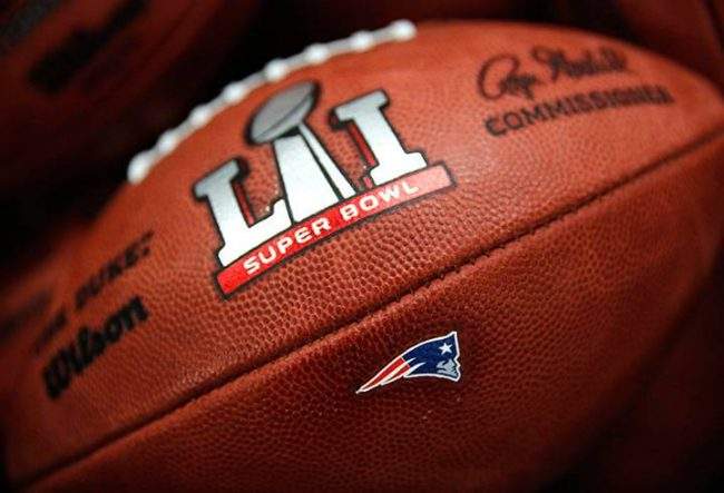 The New England Patriots' NFL Super Bowl LI game ball is finished with the team's logo affixed to it at the Wilson Sporting Goods factory Monday, Jan. 23, 2017, in Ada, Ohio. 