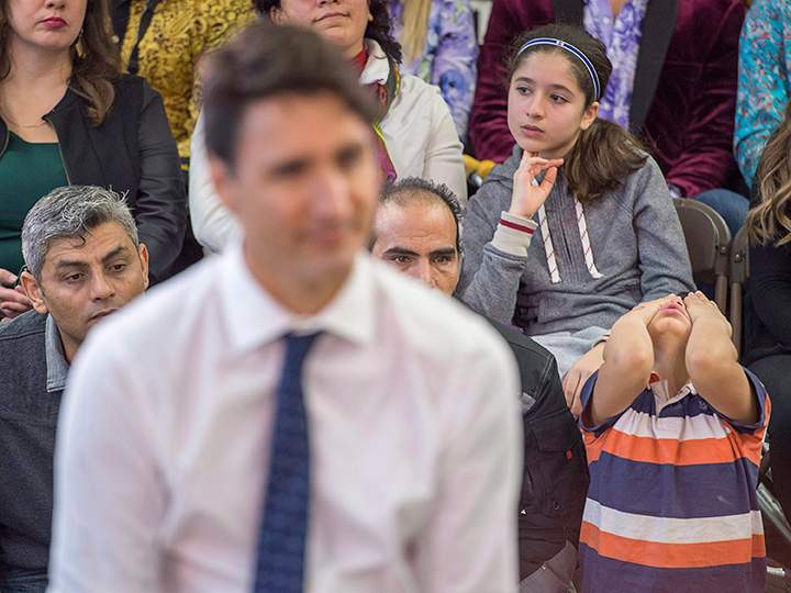 A young boy attends a town hall meeting with Prime Minister Justin Trudeau during a visit to the Cultural Centre in Fredericton on Tuesday, Jan. 17, 2017. 