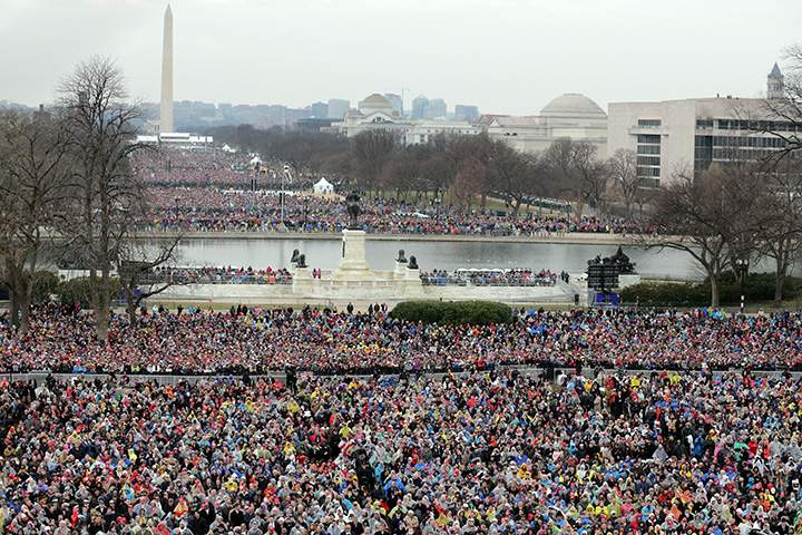 Crowds on the National Mall and in front of the U.S. Capitol watch U.S. President Donald Trump deliver his inaugural address on the West Front of the U.S. Capitol on January 20, 2017 in Washington, DC.