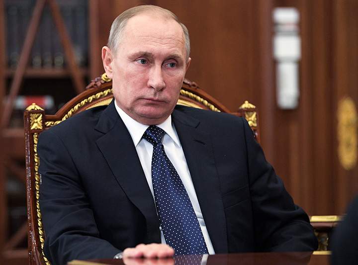 Russian President Vladimir Putin listens during a meeting in the Moscow's Kremlin on Monday, Jan. 9, 2017. 