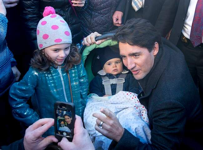 Prime Minister Justin Trudeau poses for a photo during a visit to a Tim Hortons in Hampton, N.B. on Tuesday, Jan. 17, 2017. THE CANADIAN PRESS/Andrew Vaughan.