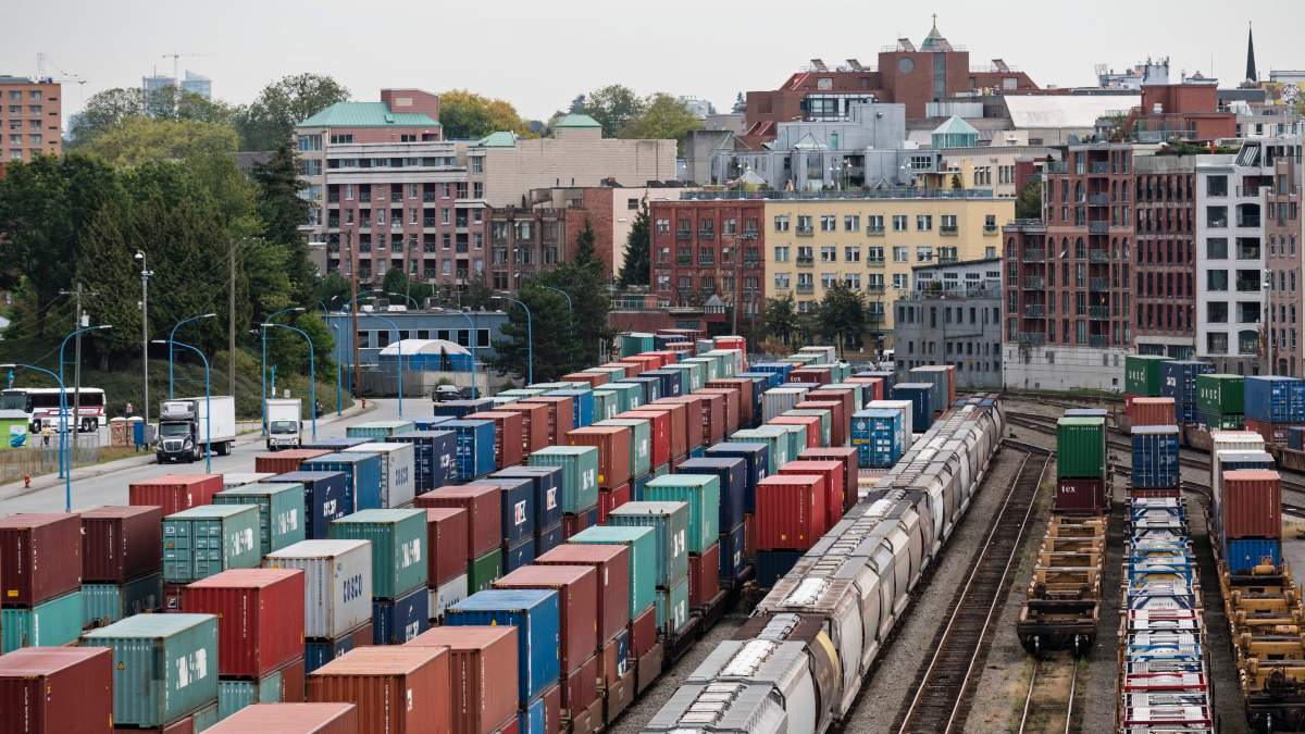 Hopper cars and railcars with intermodal shipping containers on Canadian Pacific tracks along the waterfront, downtown Vancouver, B.C., Sept. 9, 2016.