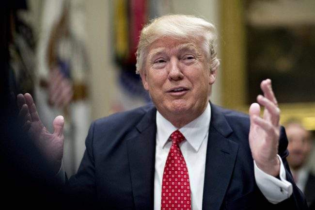 U.S. President Donald J. Trump gestures while speaking as he meets with county sheriffs during a listening session in the Roosevelt Room of the White House in Washington, D.C. on Feb. 7, 2017.