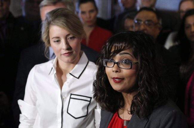 Liberal MP Iqra Khalid makes an announcement about an anti-Islamophobia motion on Parliament Hill while Minister of Canadian Heritage Melanie Joly looks on in Ottawa on Wednesday, Feb. 15, 2017. 