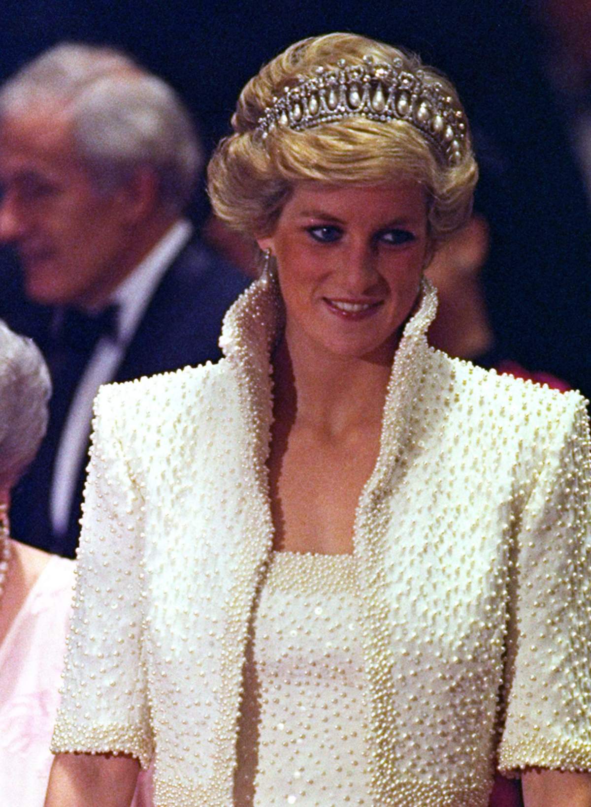 FILE – In this 1989 file photo, Diana, Princess of Wales smiles during an official visit to Hong Kong. (AP Photo/Liu Heung Shing, file)