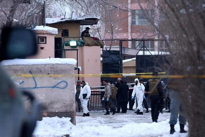 Afghan security officials stand guard outside the Afghan Supreme court building after a suicide bomb blast in Kabul, Afghanistan, 07 February 2017. 