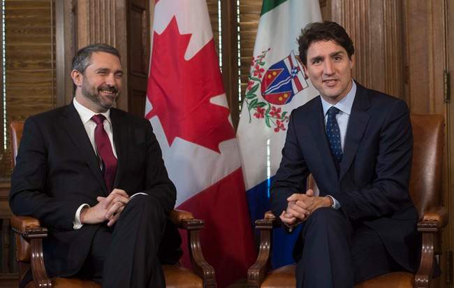 Yukon Premier Sandy Silver smiles as he listens to Prime Minister Justin Trudeau before a meeting in the prime minister's office on Parliament Hill, Wednesday, February 8, 2017 in Ottawa. THE CANADIAN PRESS/Adrian Wyld.