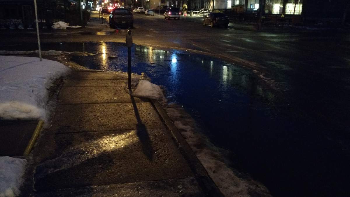 A backed-up catch basin on 13th Avenue.