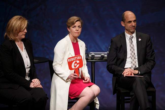 Kellie Leitch holds up a rebuttal sign during the Conservative leadership debate at the Maclab Theatre in Edmonton, Alta., on Tuesday, Feb. 28, 2017.
