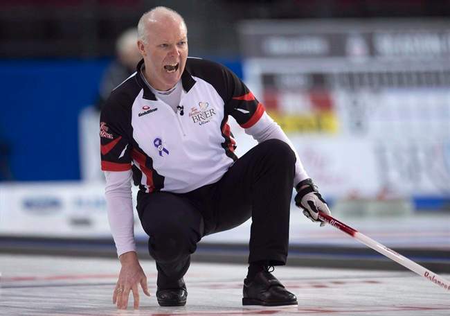 Team Ontario skip Glenn Howard reacts to his shot entering the house during round robin competition against Team PEI at the Brier curling championship, Wednesday, March 9, 2016 in Ottawa. 
