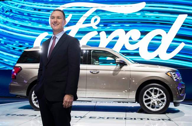 Ford Canada's new president and CEO says the company's financial commitment to auto manufacturing in Canada has not wavered since the election of U.S. President Donald Trump. Ford Canada President Mark Buzzell poses in front of the 2017 Ford Expedition during the Canadian International Autoshow, in Toronto on Thursday, February 16, 2017.