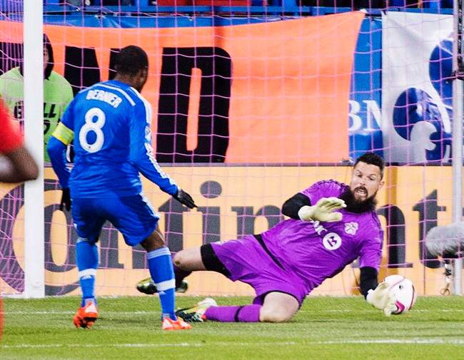 Montreal Impact midfielder Patrice Bernier (8) scores the first goal against Toronto FC goalkeeper Chris Konopka (1) during first half Major League Soccer sudden death playoff game in Montreal on October 29, 2015. Former Toronto FC goalkeeper Chris Konopka has joined FC Edmonton of the North American Soccer League. 