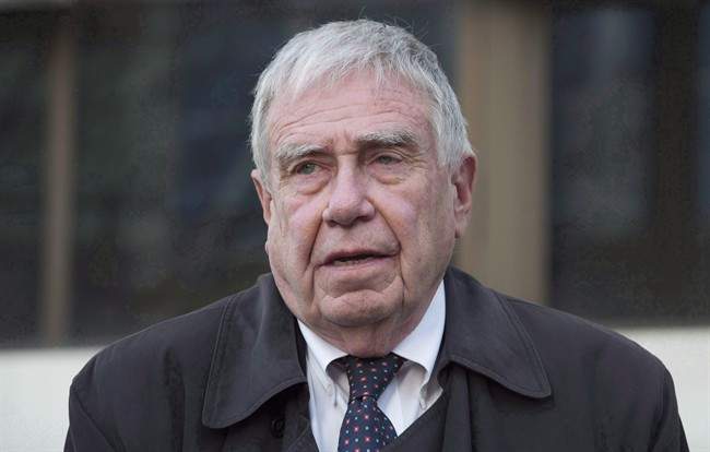 Bruce Carson leaves the courthouse after appearing in court for a verdict in his case in Ottawa on November 17, 2015. 