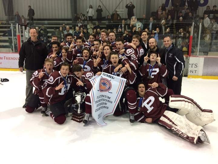 The St. Paul's Crusaders pose with their championship trophy and banner following a sweep of the Dakota Lancers in the championship series.