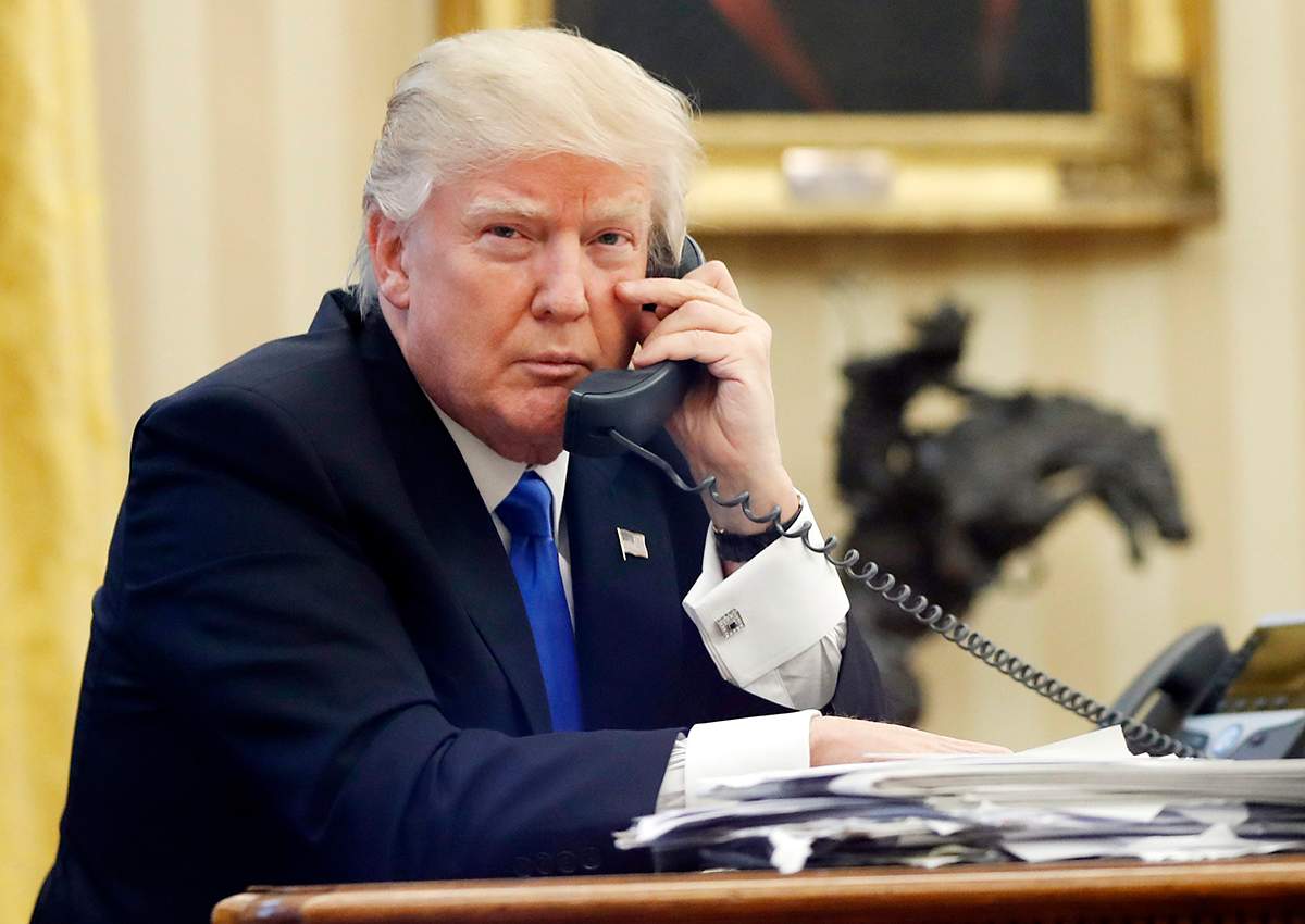 In this Jan. 28, 2017, file photo, U.S. President Donald Trump speaks on the phone.