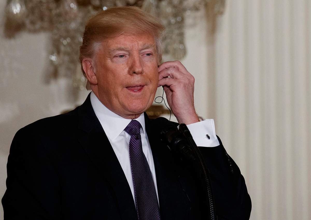 President Donald Trump listens as Canadian Prime Minister Justin Trudeau speaks during a joint news conference in the East Room of the White House, Monday, Feb. 13, 2017, in Washington.