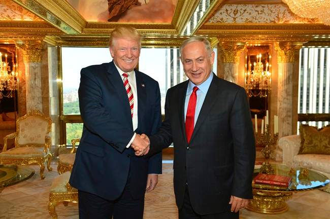 In this handout photo made on Sunday, Sept. 25, 2016, provided by the Israeli Government Press Office, then-Republican Presidential candidate Donald Trump shakes hands with Israeli Prime Minister Benjamin Netanyahu in New York.