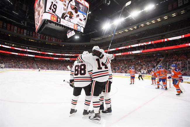 Chicago Blackhawks celebrate a goal against the Edmonton Oilers during first period NHL action in Edmonton, Alta., on Saturday February 11, 2017. 
