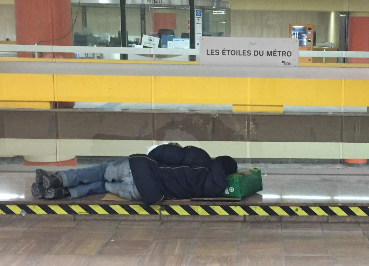 A homeless person sleeps at the McGill station in Montreal's Metro, Friday, Jan. 27, 2017.