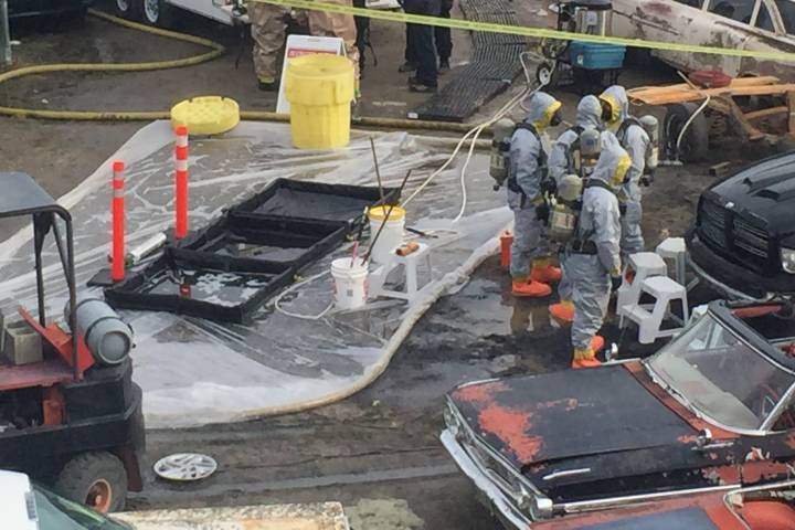 RCMP in hazmat suits at West Kelowna business in March 2016 as part of large-scale fentanyl bust.