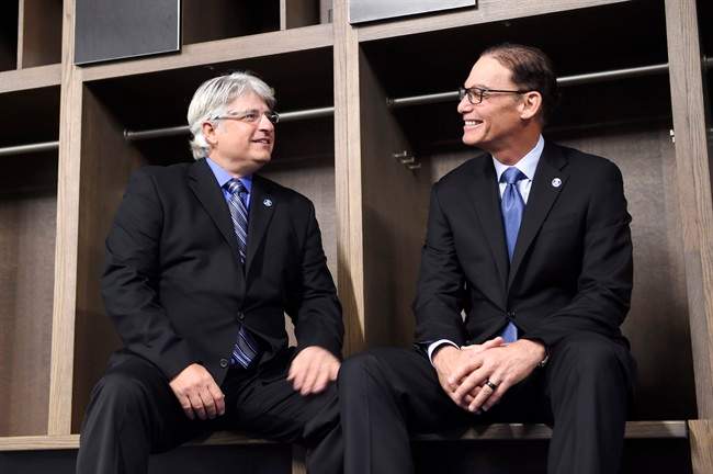 New Toronto Argonauts head coach Marc Trestman, right, and new general manager Jim Popp pose for a photo ahead of a press conference to announce their hirings in Toronto on Tuesday, February 28, 2017. THE CANADIAN PRESS/Frank Gunn.