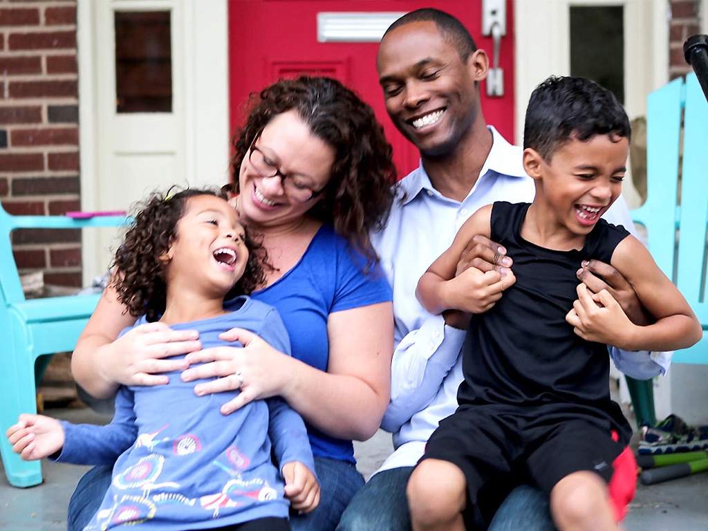 JR Ford and his wife Vanessa play with their two kids, one of whom is transgender.