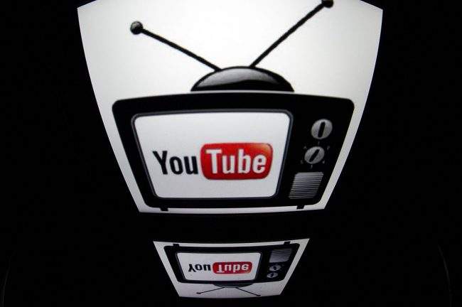 The "YouTube" logo is seen on a tablet screen in Paris, Dec. 4, 2012. 
