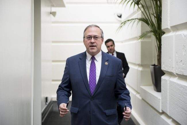 Rep. David Young, R-Iowa, arrives for the House Republican Conference meeting in the Capitol on Wednesday, Dec. 16, 2015. 