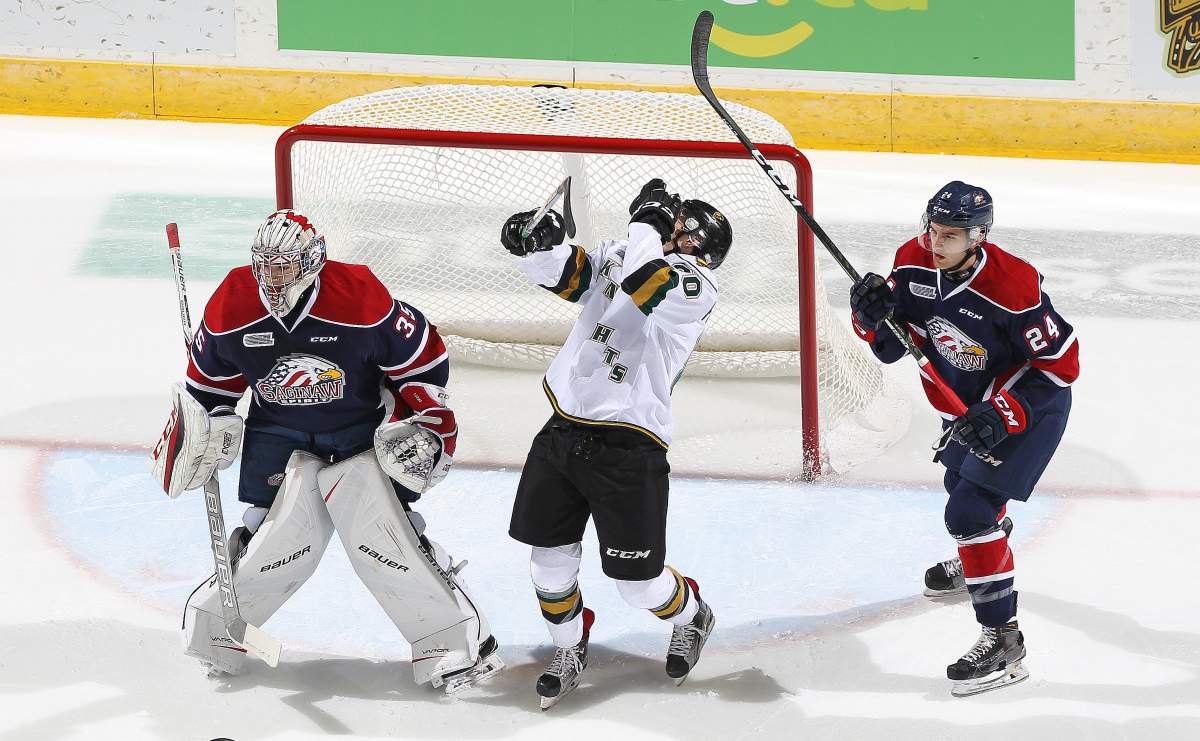 Brock Hill #24 of the Saginaw Spirit takes a high sticking penalty for hitting Alex Formenton #80 of the London Knights in the face during an OHL game. (Photo by Claus Andersen/Getty Images).