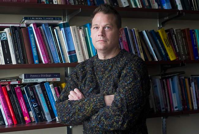 Jason Carmichael, an associate professor in the department of sociology at McGill University poses in his office in Montreal, Thursday, February 23, 2017. During the summers of 2015 and 2016 McGill University professor Jason Carmichael tried to study what factors influenced sentencing outcomes for people convicted of drunk driving, but he ran into a problem. 