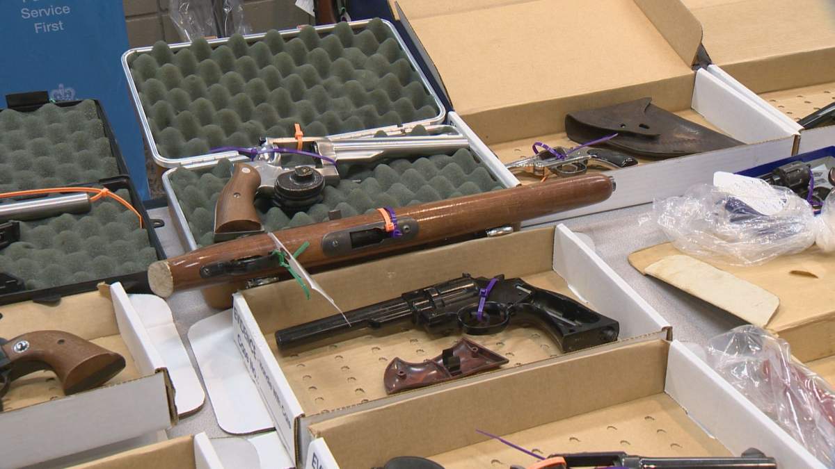 The sawed-off rifle (centre) is one of the 25 restricted or prohibited firearms turned in.