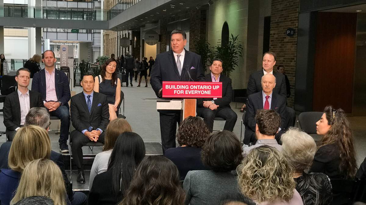 Finance Minister Charles Sousa speaks to reporters at MaRs in Toronto on Feb. 21, 2017.