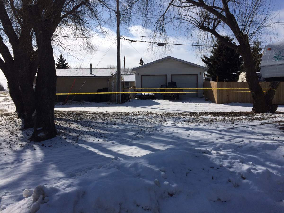 Police tape surrounds the Wainwright, Alta. home where Nichole Clifford, 31, was found dead on Friday, February 24, 2017.