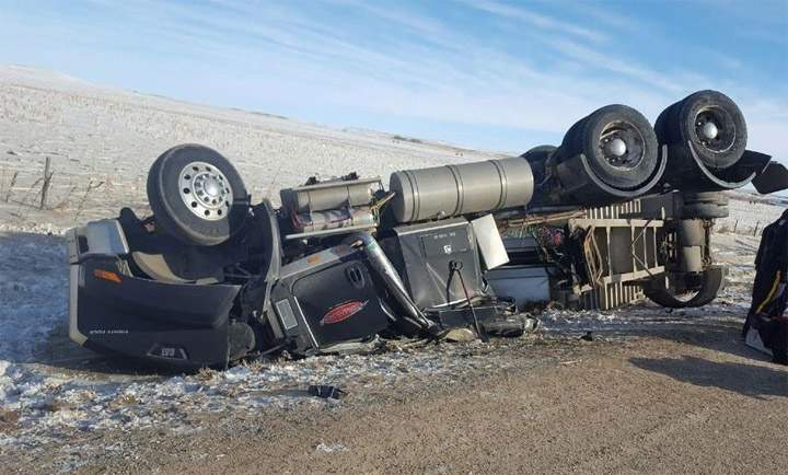 Mounties say distracted driving is a factor in a rollover on Highway 51 near Kerrobert, Sask., that trapped the driver of a semi.