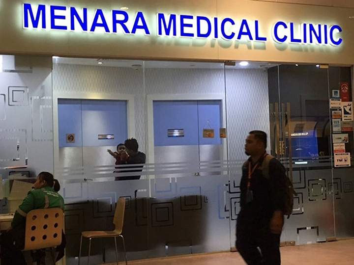 A man walks past the airport clinic where Kim Jong Nam was believed to have been taken in the low-budget airline terminal of Kuala Lumpur International Airport in Kuala Lumpur, Malaysia, Wednesday, Feb. 15, 2017.