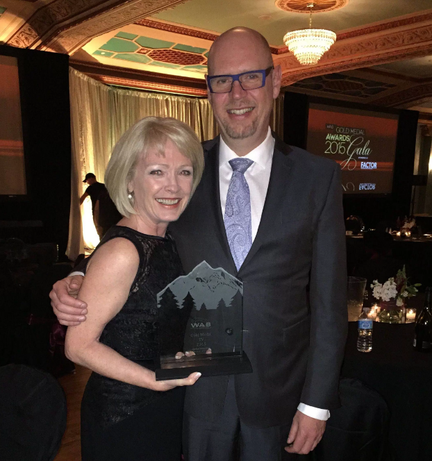 Lesley MacDonald celebrates with Kenton Boston of Global News after accepting the prestigious Gold Medal Award from the Western Association of Broadcasters in Banff, Alberta.