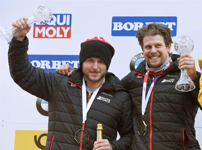 Canada's Justin Kripps, left, and Jesse Lumsden, celebrate their second place after the men's two-man bob race at the Bobsleigh and Skeleton World Championships at Lake Koenigssee, Germany, Sunday Feb. 19. 2017.