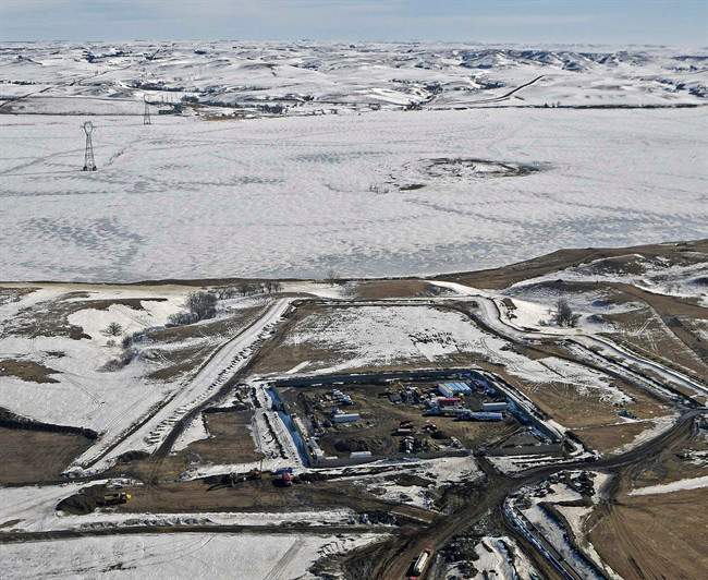 This aerial photo shows a site where the final phase of the Dakota Access Pipeline will take place with boring equipment routing the pipeline underground and across Lake Oahe to connect with the existing pipeline in Emmons County, Monday, Feb. 13, 2017, in Cannon Ball, N.D. It is the last big section of the $3.8 billion pipeline, which would carry oil from North Dakota to Illinois. A federal judge on Monday refused to stop construction on the last stretch of the pipeline, which is progressing much faster than expected. 