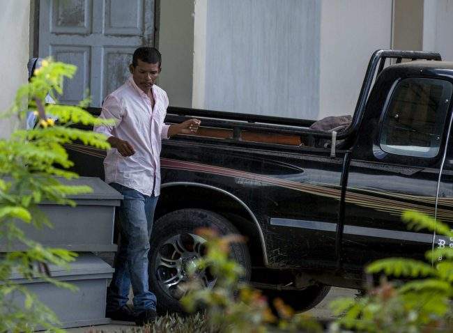Nicaraguan Reynaldo Peralta Rodriguez  leaves the morgue with the coffin of his wife, Vilma Trujillo, who was burned in a bonfire in Managua, Nicaragua, Feb. 28, 2017.