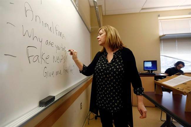 In this Friday, Jan. 20, 2017, photo, Pat Winters Lauro, a journalism professor at Kean University in Union, N.J., leads a class discussion talking about fake news. 