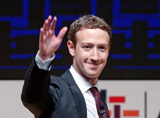 In this Nov. 19, 2016 file photo, Mark Zuckerberg, chairman and CEO of Facebook, waves at the CEO summit during the annual Asia Pacific Economic Cooperation (APEC) forum in Lima, Peru.
