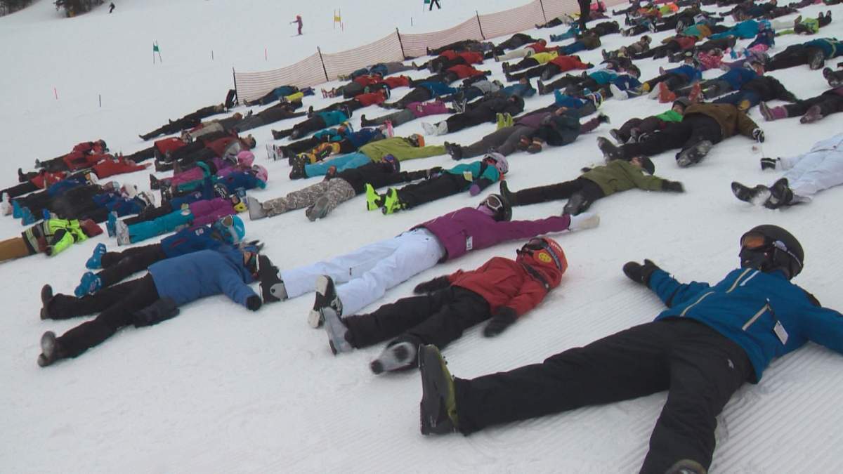 Edmonton skiers and patrollers participate in a Canadian Ski Patrol event to break the Guinness record for most snow angels, Saturday, Feb. 4, 2017. 