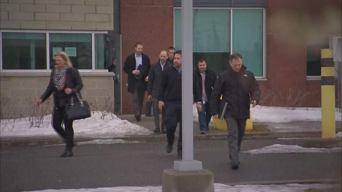 Officers are seen leaving a meeting headed by Montreal police Chief Philippe Pichet. Saturday, Feb. 25, 2017.