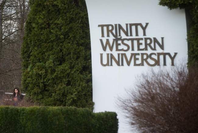 A student leaves Trinity Western University in Langley, B.C., on Wednesday, February 22, 2017.