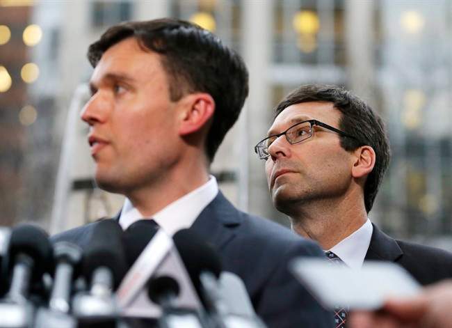 Washington state Solicitor General Noah Purcell, left, and Attorney General Bob Ferguson, right, listen to questions from reporters, following a hearing in federal court Friday, Feb. 3, 2017, in Seattle. A U.S. judge on Friday temporarily blocked President Donald Trump's ban on people from seven predominantly Muslim countries from entering the United States after Washington state and Minnesota urged a nationwide hold on the executive order that has launched legal battles across the country.