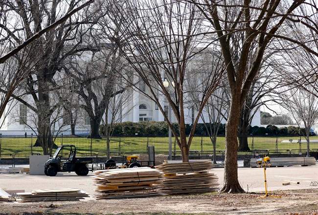 In this photo taken Feb. 17, 2017, construction material is seen along Pennsylvania Avenue in front of the White House in Washington, as work continues with the dismantling of the presidential inauguration reviewing stand.