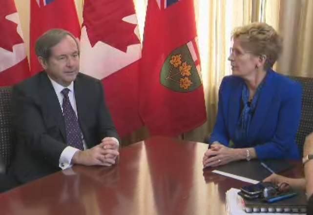Ontario Premier Kathleen Wynne and Canada's ambassador to the United States David MacNaughton meet at Queen's Park in Toronto on Feb. 15, 2017.